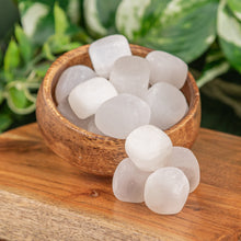 Load image into Gallery viewer, Tumbled Selenite displayed on a wooden surface in a bowl whilst over flowing - Down to Earth