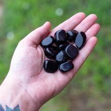 Load image into Gallery viewer, Tumbled Black Obsidian in the Palm of a Hand - Down To Earth