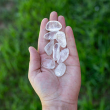 Load image into Gallery viewer, Tumbled Clear Quart in the Palm of a Hand - Down To Earth
