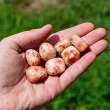 Load image into Gallery viewer, Tumbled Sunstone in the Palm of a Hand - Down To Earth