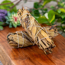 Load image into Gallery viewer, Yerba Santa Smudge Stick on a wooden surface slight front angle - Down to Earth