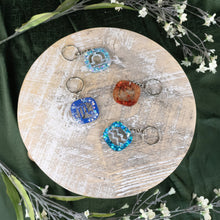 Load image into Gallery viewer, Glitter Resin Zodiac Keychain Group Photo on a style background - Down To Earth