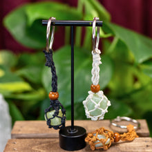 Load image into Gallery viewer, "Three adjustable keychains with crystals inside them," - Down to Earth.