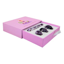Load image into Gallery viewer, "An open light pink box with four pieces of amethyst within. These pieces are used for Kegel exercises to strengthen the pelvic floor," - Down to Earth.