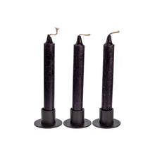 Load image into Gallery viewer, Photograph of three black ritual candles. These candles are sold by Down to Earth based out of Wichita, Kansas. - Down to Earth.