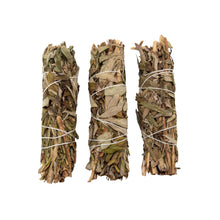 Load image into Gallery viewer, "Three bundles of black sage wrapped in white twine on a white background," - Down to Earth.