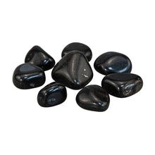 Load image into Gallery viewer, "Side angle of eight pieces of tumbled black tourmaline against a white background," - Down to Earth.