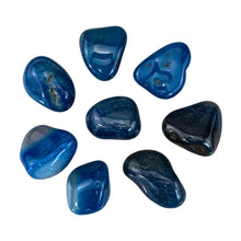 Load image into Gallery viewer, "Eight pieces of tumbled blue agate against a white background," - Down to Earth.