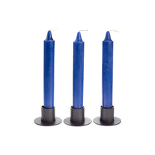 Load image into Gallery viewer, Picture of three blue ritual candles in black candle holders. - Down to Earth.