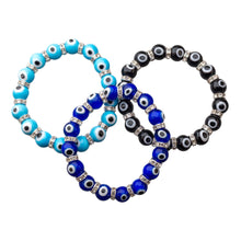 Load image into Gallery viewer, "Three evil eye bracelets in the colors light blue, dark blue and black. This symbol is used in the metaphysical community to ward away negative energy," - Down to Earth.