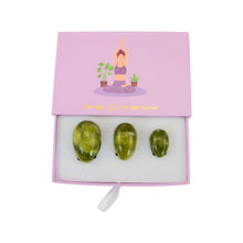 Load image into Gallery viewer, "Top-down view of a green flower jade yoni egg set against a white background," - Down to Earth.