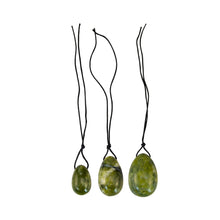 Load image into Gallery viewer, "Three green flower jade yoni eggs outside of their box," - Down to Earth.