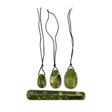 Load image into Gallery viewer, "Three green flower jade yoni eggs with a crystal wand. These items are used to strengthen the pelvic floor with Kegel exercises," - Down to Earth.