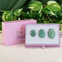 Load image into Gallery viewer, "Set of three green aventurine yoni eggs within an open light pink box," - Down to Earth.