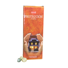 Load image into Gallery viewer, "Display case of a HEM Protection Incense Stick box with three green crystals in front on a white background," - Down to Earth.
