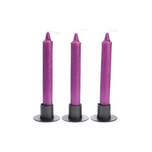 Load image into Gallery viewer, Photograph of three purple ritual candles in black metal candle holders. - Down to Earth.