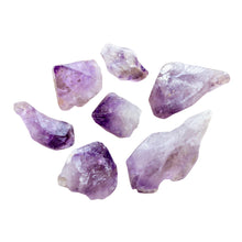 Load image into Gallery viewer, A picture of raw amethyst points with deep purple tips. - Down to Earth.