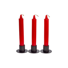 Load image into Gallery viewer, Photograph of three red ritual candles. They are all in black metal candle holders. - Down to Earth.