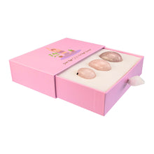 Load image into Gallery viewer, "Left-side view of an open yoni egg box with three rose quartz spheres within it," - Down to Earth.