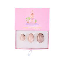 Load image into Gallery viewer, "Top-down view of a three-piece yoni egg set in the crystal rose quartz," - Down to Earth.