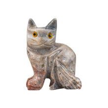 Load image into Gallery viewer, "Stone figurine of a cat with yellow eyes," - Down to Earth.