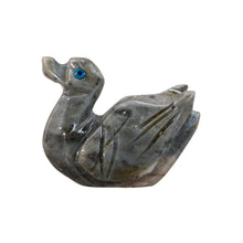 Load image into Gallery viewer, "Left side of a carved stone figurine in the shape of a duck," - Down to Earth.