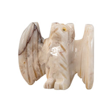 Load image into Gallery viewer, "Stone sculpture of an eagle with its wings open," - Down to Earth.