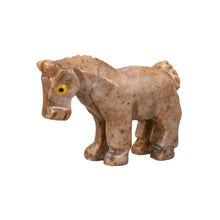 Load image into Gallery viewer, "Side angle of a stone horse sculpture with yellow eyes," - Down to Earth.