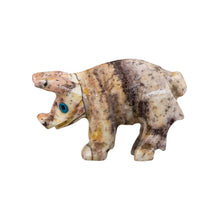 Load image into Gallery viewer, "Left side of a carved stone figurine in the shape of a pig with blue eyes," - Down to Earth.