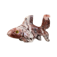 Load image into Gallery viewer, "A marbled miniature stone sculpture in the shape of a shark with yellow eyes against a white background," - Down to Earth.