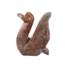 Load image into Gallery viewer, "Left side of a stone-carved miniature made out of red marbled crystals in the shape of a swan," - Down to Earth.