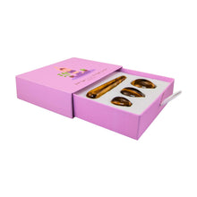Load image into Gallery viewer, "Left-side view of an open yoni egg box set with three pieces of tiger's eye inside," - Down to Earth.