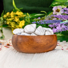 Load image into Gallery viewer, "Wooden bowl overflowing with pieces of tumbled white howlite," - Down to Earth.