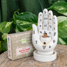 Load image into Gallery viewer, "Palmistry Incense Burner holding a Satya White Sage Dhoop Cone on a wooden plank with green foliage in the background," - Down to Earth.