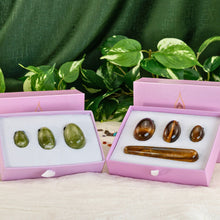 Load image into Gallery viewer, "Two sets of yoni eggs in light pink boxes with a greenery background. These items are used in Kegel exercises to strengthen the pelvic floor," - Down to Earth.