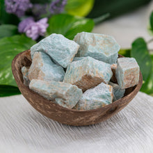 Load image into Gallery viewer, Raw Amazonite side angle in a coconut shell - Down To Earth
