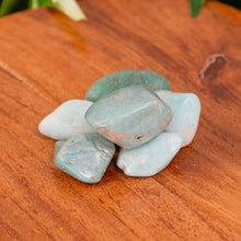 Load image into Gallery viewer, Amazonite Tumbled on a wooden surface - Down to Earth

