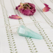 Load image into Gallery viewer, Amazon Faceted Pendulum on a style background - Down To Earth
