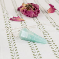 Amazon Faceted Pendulum on a style background - Down To Earth