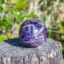 Load image into Gallery viewer, 40mm Crystal Sphere Amethyst outdoor photo - Down to Earth
