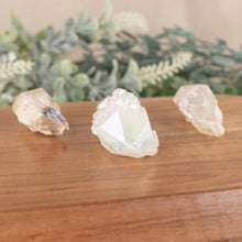 Load image into Gallery viewer, Three Angel Aura Qaurtz Points side facing on a style background - Down To Earth

