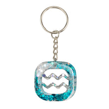 Load image into Gallery viewer, Aquarius Glitter Resin Keychain on a white background - Down To Earth
