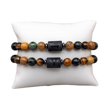 Load image into Gallery viewer, "Two Aries Zodiac Bracelets that showcase the astrological symbol as well as the animal that represents the sign on a white background," - Down to Earth.
