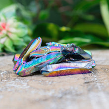 Load image into Gallery viewer, Rainbow Aura Quartz Crystal Point on a wooden surface low angle styled photo - Down to Earth
