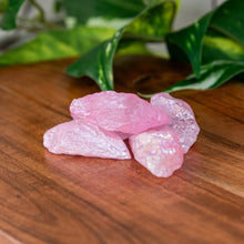 Load image into Gallery viewer, Rose Aura Quartz Raw on a wooden surface - Down to Earth 
