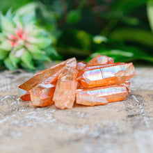 Load image into Gallery viewer, Tangerine Aura Quartz Crystal Point on a wooden background low angle styled photo - Down to Earth
