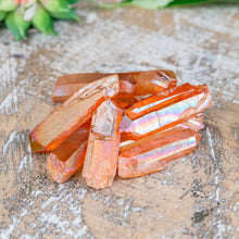 Load image into Gallery viewer, Tangerine Aura Quartz Crystal Point on a wooden background high angle styled photo - Down to Earth
