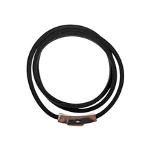 Load image into Gallery viewer, "Top-down view of a Black Leather Wrap Bracelet that stacks three times on the wrist on a white background," - Down to Earth.
