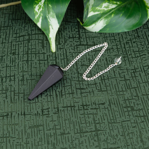 Black Obsidian Pendulum on a green cloth - Down to Earth 