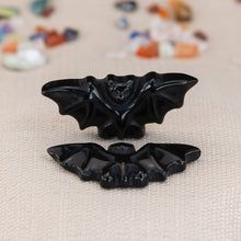 Load image into Gallery viewer, Two Black Obsidian Bats on a cloth-styled photo - Down to Earth
